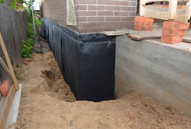 SJ Waterproofing Pros technician performing targeted Sump Pump Installation assessment in Montgomery, MN